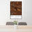 24x36 Del Norte Colorado Map Print Portrait Orientation in Ember Style Behind 2 Chairs Table and Potted Plant