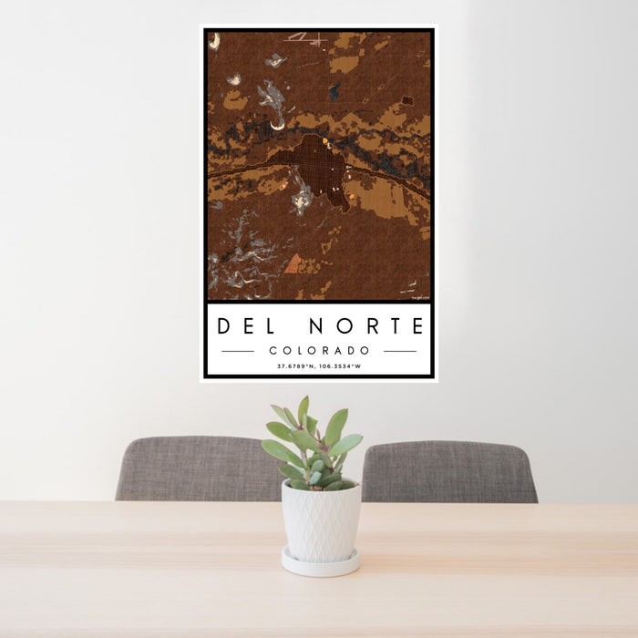 24x36 Del Norte Colorado Map Print Portrait Orientation in Ember Style Behind 2 Chairs Table and Potted Plant