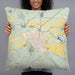 Person holding 22x22 Custom Del Norte Colorado Map Throw Pillow in Woodblock