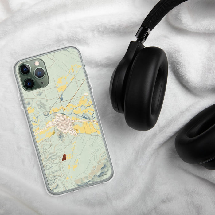 Custom Del Norte Colorado Map Phone Case in Woodblock on Table with Black Headphones