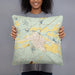 Person holding 18x18 Custom Del Norte Colorado Map Throw Pillow in Woodblock