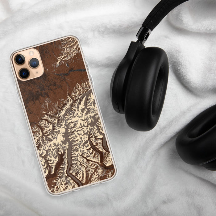 Custom Denali National Park Map Phone Case in Ember on Table with Black Headphones