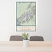 24x36 Denali National Park Map Print Portrait Orientation in Woodblock Style Behind 2 Chairs Table and Potted Plant