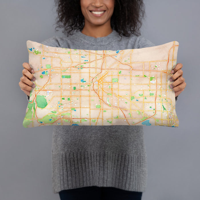 Person holding 20x12 Custom Denver Colorado Map Throw Pillow in Watercolor