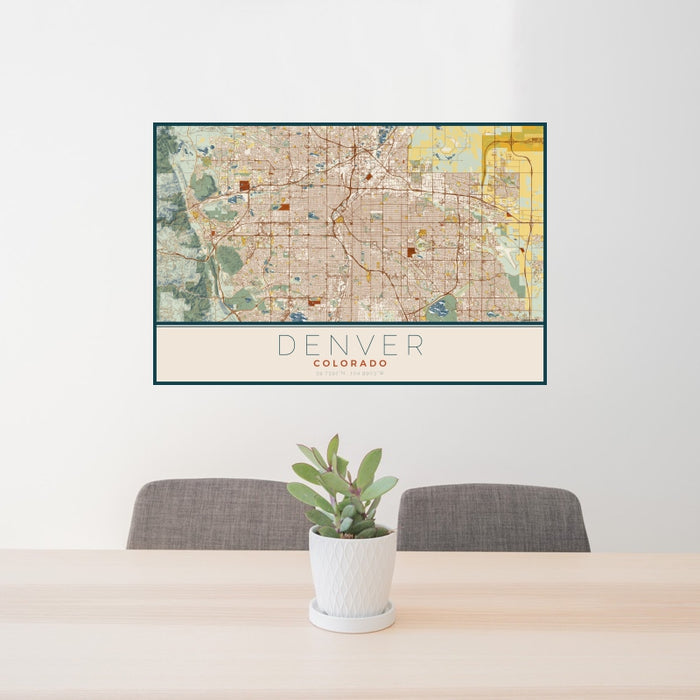 24x36 Denver Colorado Map Print Landscape Orientation in Woodblock Style Behind 2 Chairs Table and Potted Plant