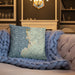 Custom Depoe Bay Oregon Map Throw Pillow in Woodblock on Cream Colored Couch