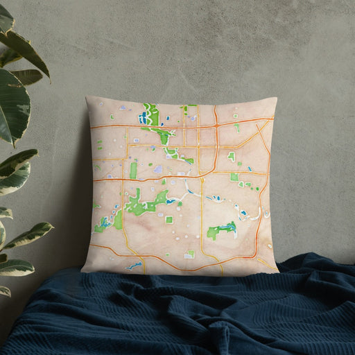 Custom Des Moines Iowa Map Throw Pillow in Watercolor on Bedding Against Wall