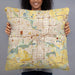 Person holding 22x22 Custom Des Moines Iowa Map Throw Pillow in Woodblock