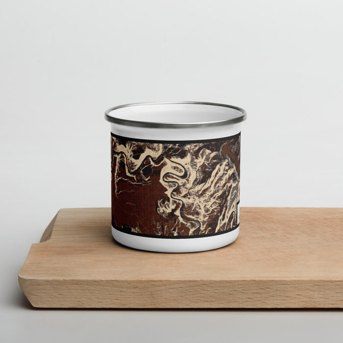 Front View Custom Dinosaur National Monument Map Enamel Mug in Ember on Cutting Board