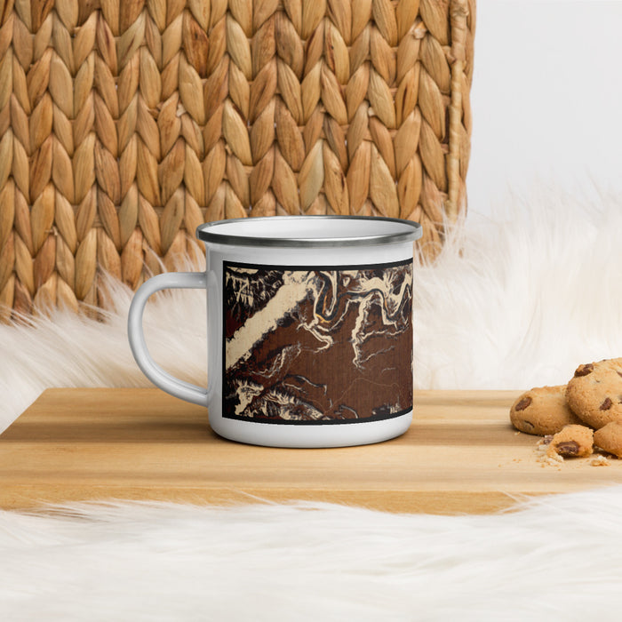 Left View Custom Dinosaur National Monument Map Enamel Mug in Ember on Table Top