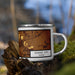 Right View Custom Dodge City Kansas Map Enamel Mug in Ember on Grass With Trees in Background