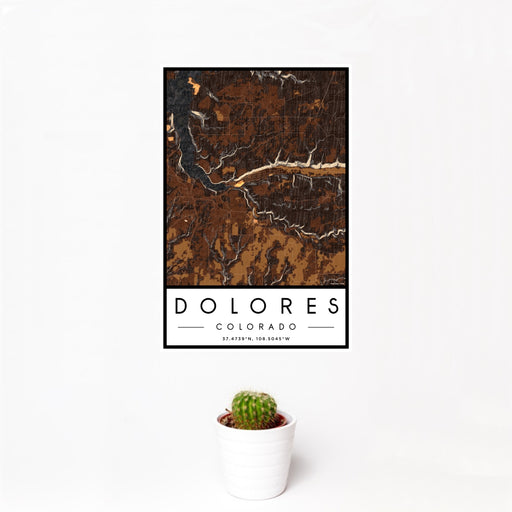12x18 Dolores Colorado Map Print Portrait Orientation in Ember Style With Small Cactus Plant in White Planter