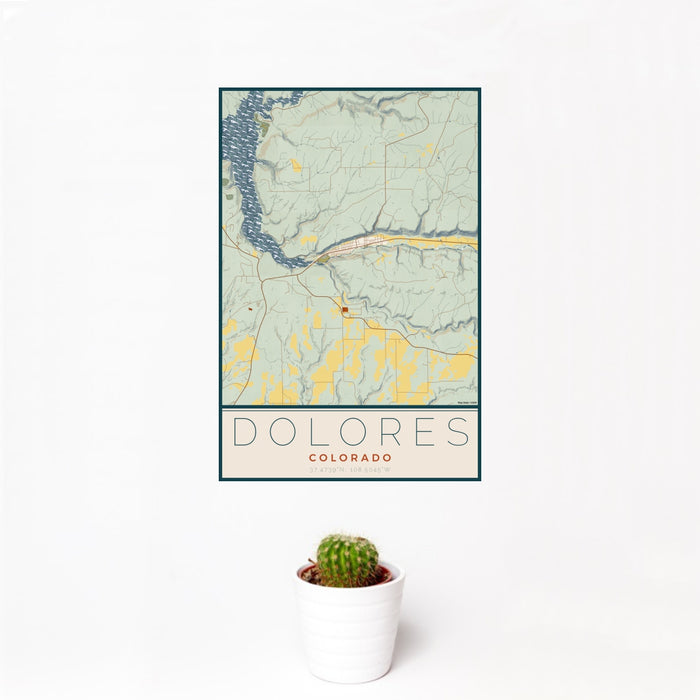 12x18 Dolores Colorado Map Print Portrait Orientation in Woodblock Style With Small Cactus Plant in White Planter