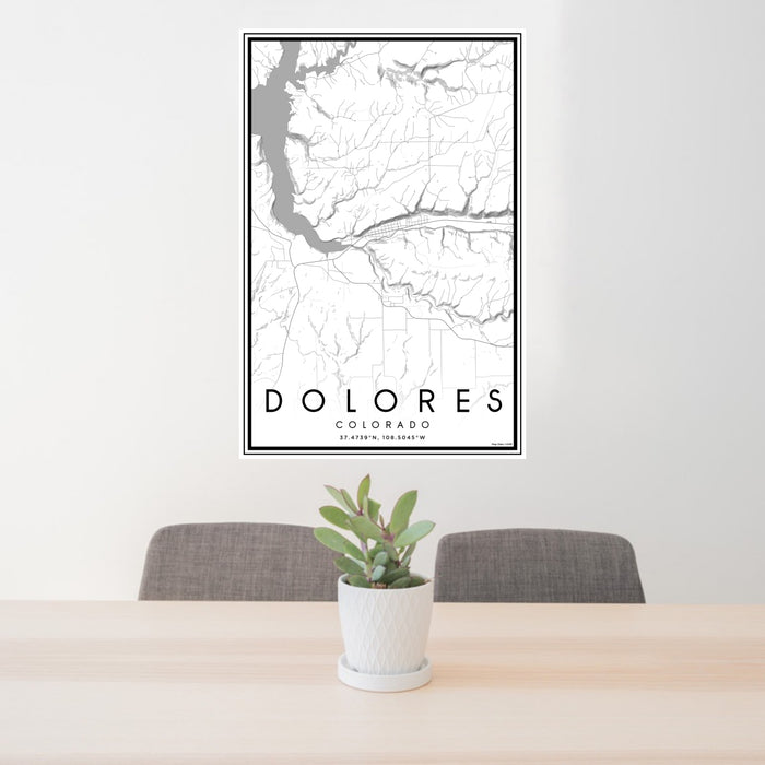 24x36 Dolores Colorado Map Print Portrait Orientation in Classic Style Behind 2 Chairs Table and Potted Plant