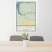 24x36 Dolores Colorado Map Print Portrait Orientation in Woodblock Style Behind 2 Chairs Table and Potted Plant