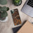 Custom Dolores Colorado Map Phone Case in Ember on Table with Laptop and Plant