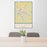 24x36 Dothan Alabama Map Print Portrait Orientation in Woodblock Style Behind 2 Chairs Table and Potted Plant