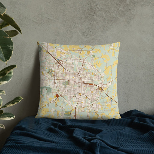 Custom Dothan Alabama Map Throw Pillow in Woodblock on Bedding Against Wall