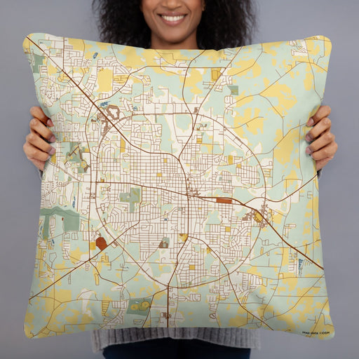 Person holding 22x22 Custom Dothan Alabama Map Throw Pillow in Woodblock