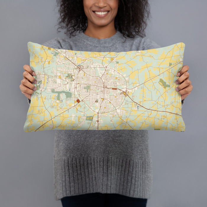 Person holding 20x12 Custom Dothan Alabama Map Throw Pillow in Woodblock
