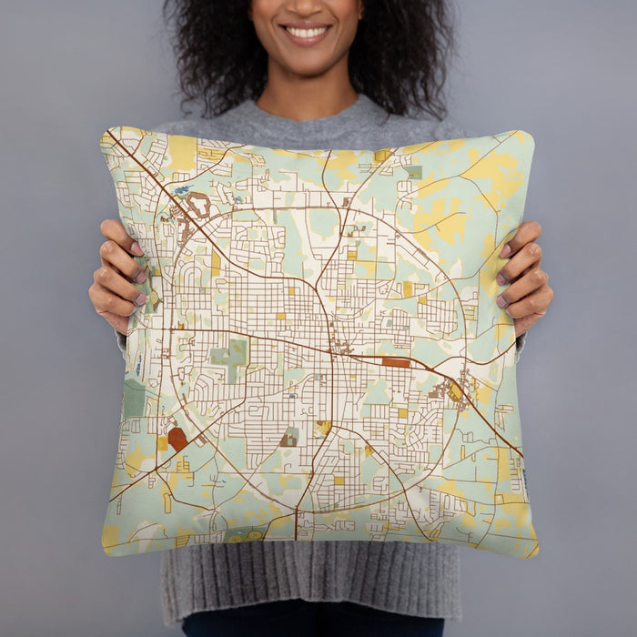 Person holding 18x18 Custom Dothan Alabama Map Throw Pillow in Woodblock
