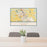 24x36 Dover Delaware Map Print Lanscape Orientation in Woodblock Style Behind 2 Chairs Table and Potted Plant