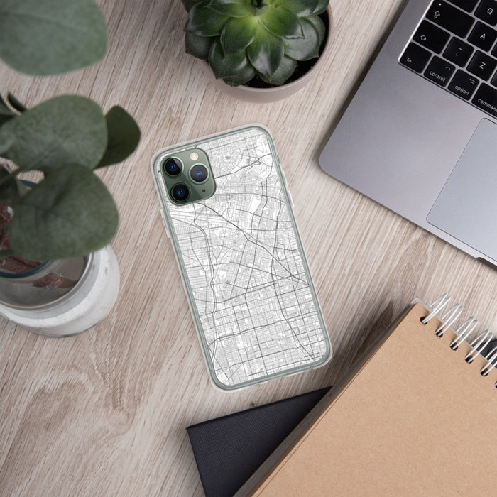 Custom Downey California Map Phone Case in Classic on Table with Laptop and Plant