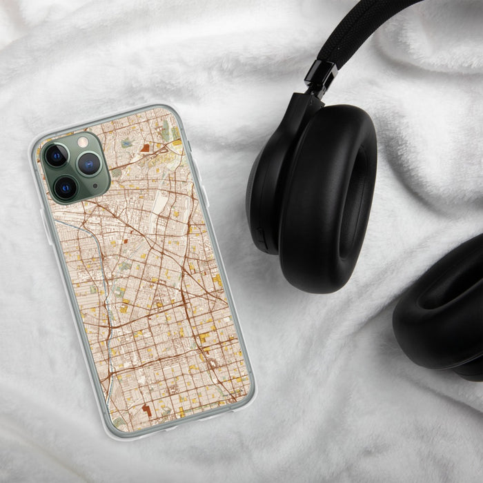 Custom Downey California Map Phone Case in Woodblock on Table with Black Headphones