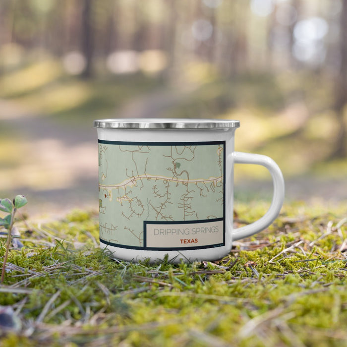 Right View Custom Dripping Springs Texas Map Enamel Mug in Woodblock on Grass With Trees in Background