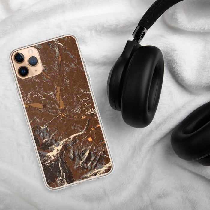 Custom Dubois Wyoming Map Phone Case in Ember on Table with Black Headphones