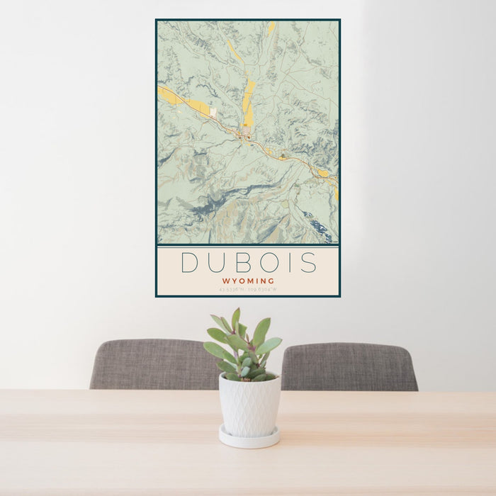 24x36 Dubois Wyoming Map Print Portrait Orientation in Woodblock Style Behind 2 Chairs Table and Potted Plant