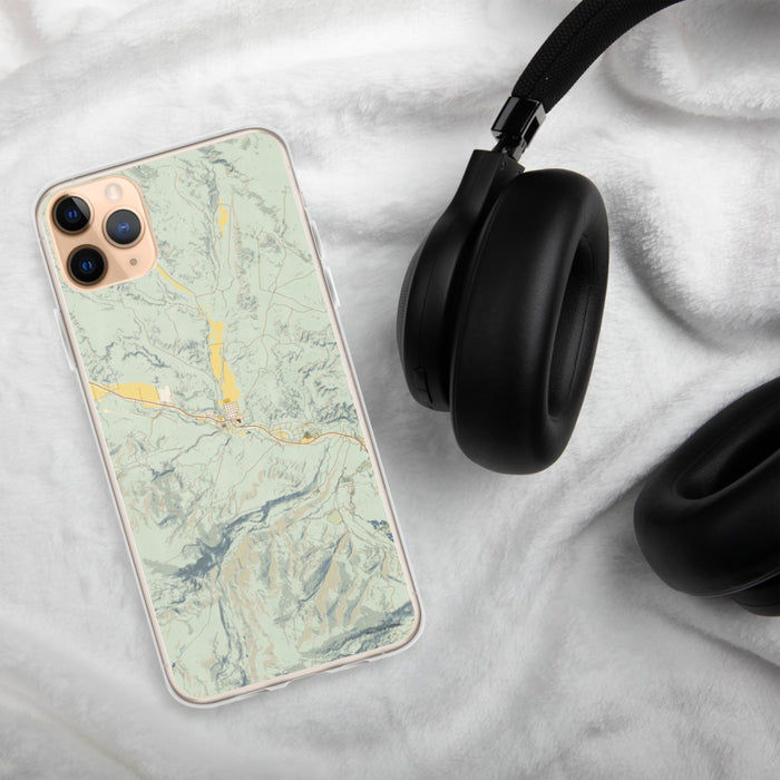 Custom Dubois Wyoming Map Phone Case in Woodblock on Table with Black Headphones