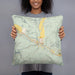 Person holding 18x18 Custom Dubois Wyoming Map Throw Pillow in Woodblock
