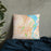 Custom Dubuque Iowa Map Throw Pillow in Watercolor on Bedding Against Wall
