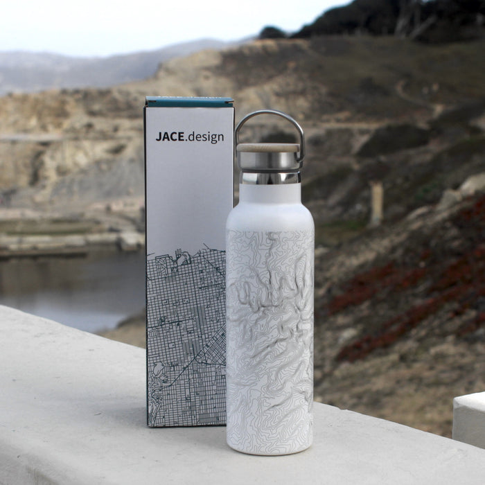 20oz Stainless Steel Insulated Bottle with Bamboo Top in White with Custom Engraving of Map on Table with Box Packaging