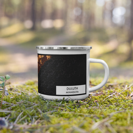 Right View Custom Duluth Minnesota Map Enamel Mug in Ember on Grass With Trees in Background