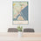 24x36 Duluth Minnesota Map Print Portrait Orientation in Woodblock Style Behind 2 Chairs Table and Potted Plant