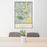 24x36 Durango Colorado Map Print Portrait Orientation in Woodblock Style Behind 2 Chairs Table and Potted Plant