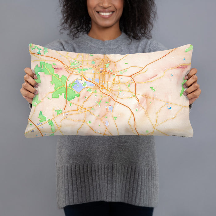 Person holding 20x12 Custom Durham North Carolina Map Throw Pillow in Watercolor