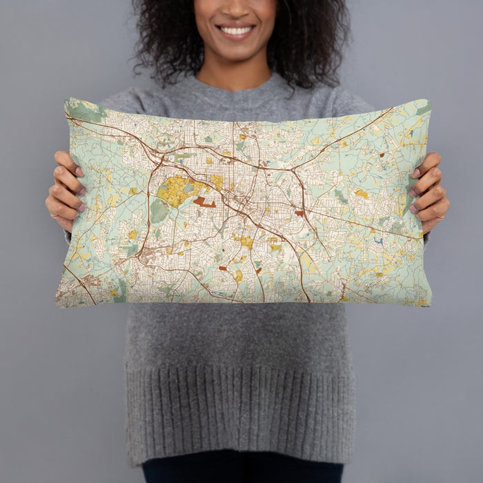 Person holding 20x12 Custom Durham North Carolina Map Throw Pillow in Woodblock