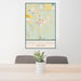 24x36 East Helena Montana Map Print Portrait Orientation in Woodblock Style Behind 2 Chairs Table and Potted Plant