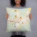 Person holding 18x18 Custom East Helena Montana Map Throw Pillow in Woodblock