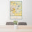 24x36 East Lansing Michigan Map Print Portrait Orientation in Woodblock Style Behind 2 Chairs Table and Potted Plant