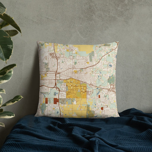 Custom East Lansing Michigan Map Throw Pillow in Woodblock on Bedding Against Wall