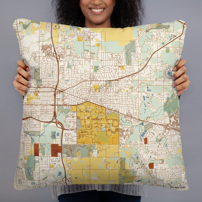 Person holding 22x22 Custom East Lansing Michigan Map Throw Pillow in Woodblock