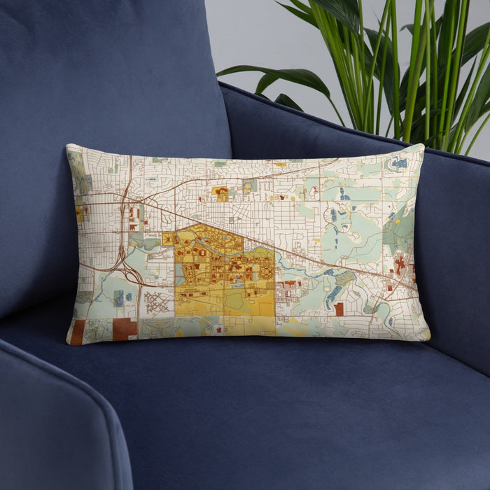 Custom East Lansing Michigan Map Throw Pillow in Woodblock on Blue Colored Chair