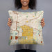 Person holding 18x18 Custom East Lansing Michigan Map Throw Pillow in Woodblock
