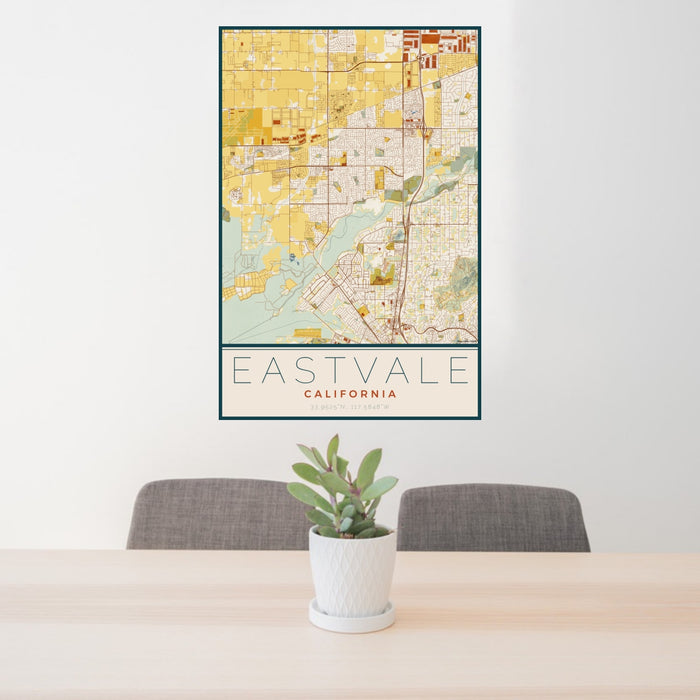 24x36 Eastvale California Map Print Portrait Orientation in Woodblock Style Behind 2 Chairs Table and Potted Plant