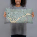 Person holding 20x12 Custom Eastvale California Map Throw Pillow in Afternoon