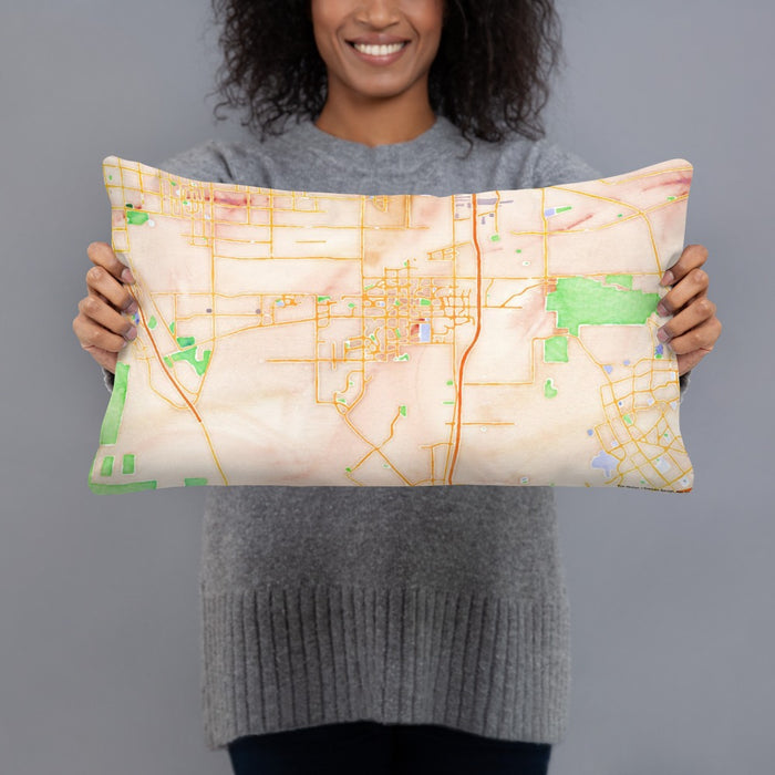 Person holding 20x12 Custom Eastvale California Map Throw Pillow in Watercolor